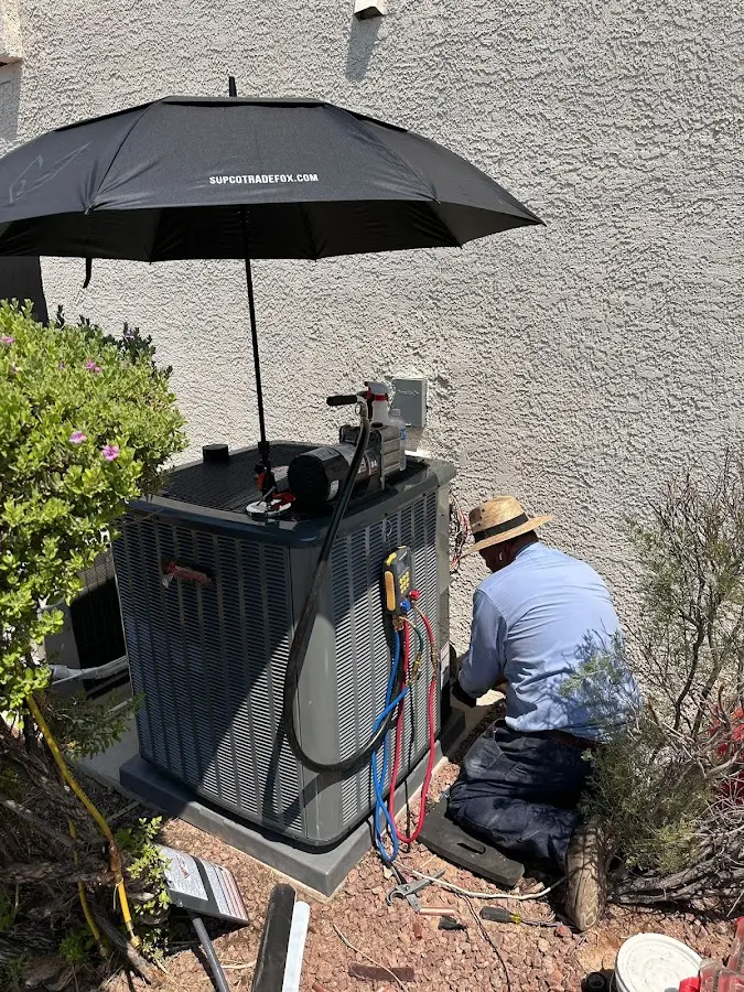 HVAC technician performing outdoor AC maintenance in Horseheads